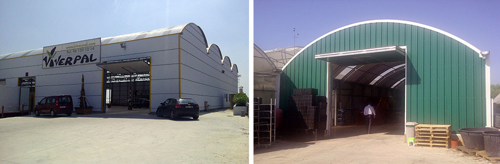 Curved roof warehouse with large lift-gates installed